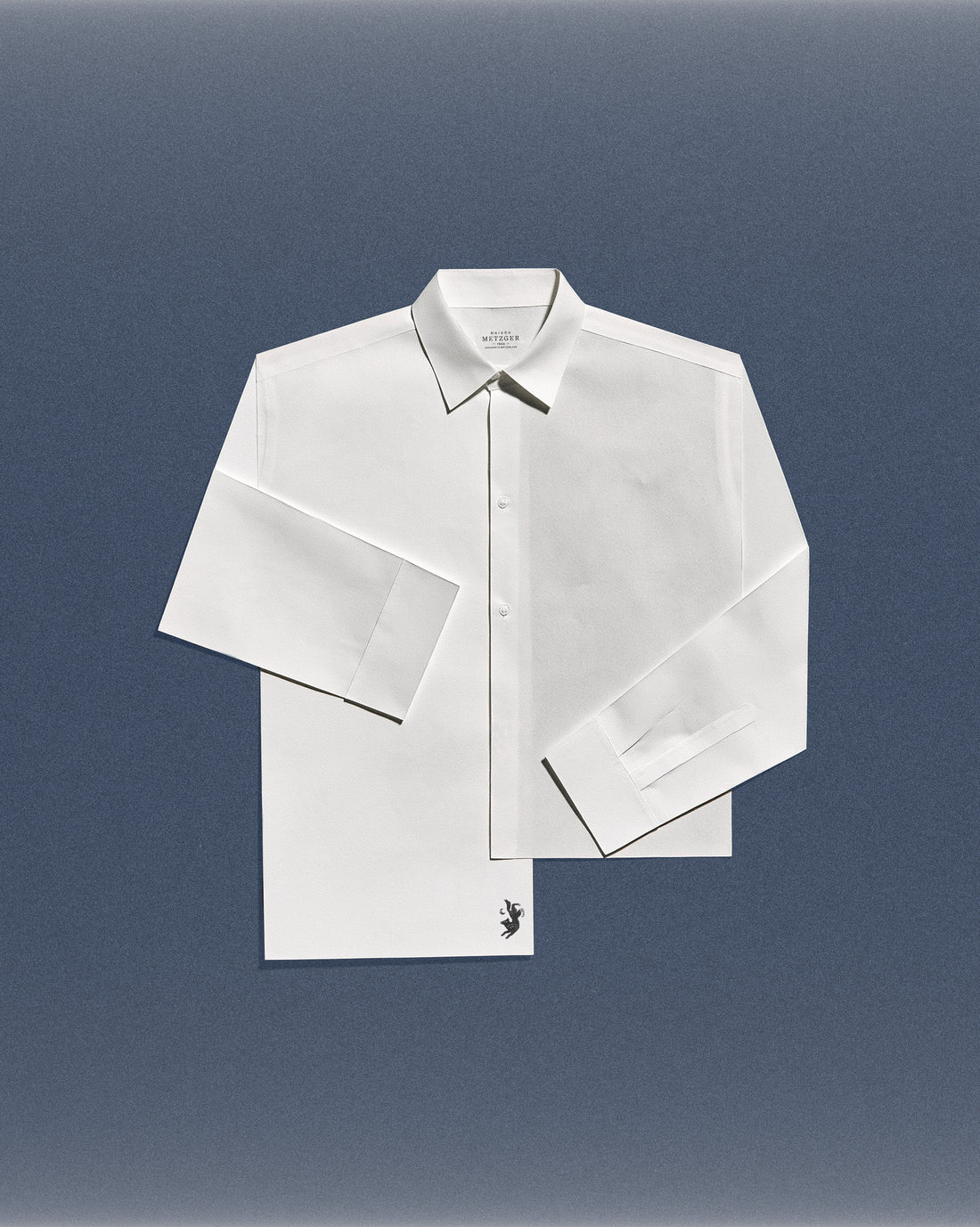 Maison Metzger white shirt on a blue background